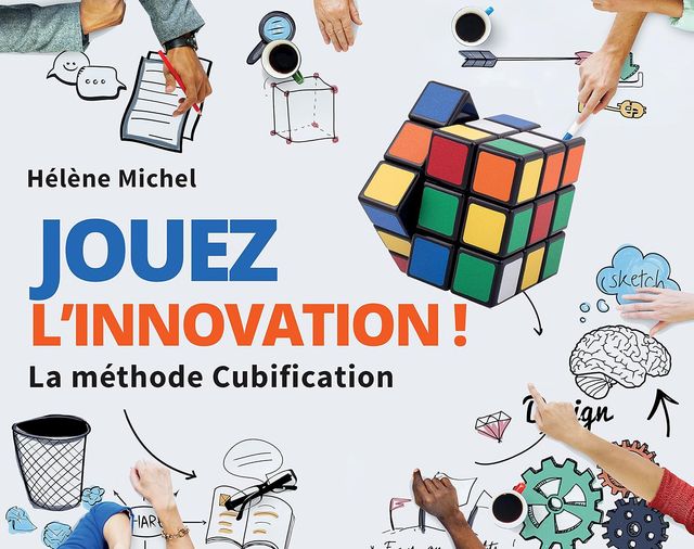 Couverture du livre « Jouez l’innovation ! La méthode Cubification » d’Hélène Michel : un Rubik’s Cube sur une table de travail entourée de croquis